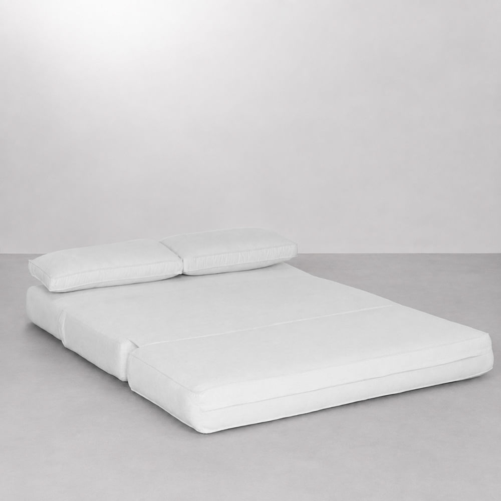 sofa-cama-dobra-deitado-com-travesseiro
